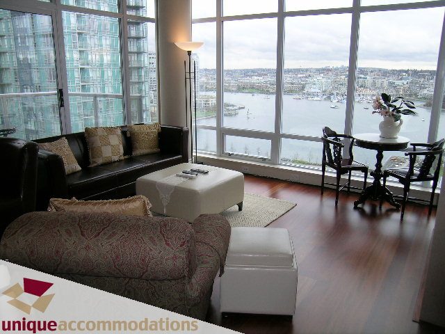 Furnished living room with hardwood floors, city view, and comfortable seating. - 1805 - 428 Beach Crescent, Vancouver Downtown