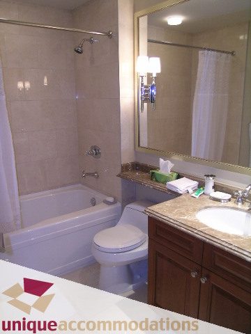 Furnished bathroom with granite countertops and a walk-in shower. - 1805 - 428 Beach Crescent, Vancouver Downtown