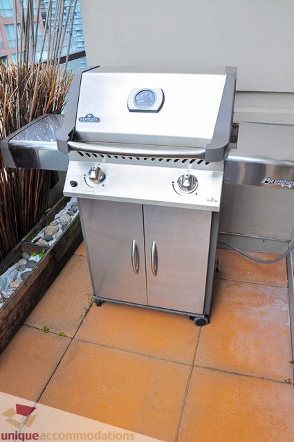 Bright patio with stainless steel grill and terracotta tiles, perfect for outdoor cooking. - PH1 - 969 Richards Street, Vancouver Downtown