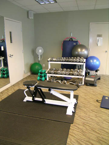 Fitness room with exercise equipment, weights, and mats. - 1503 - 198 Aquarius Mews, Vancouver Downtown
