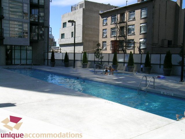 Spacious rooftop pool with city views and modern architecture. - 1904 - 1199 Seymour Street, Vancouver Downtown