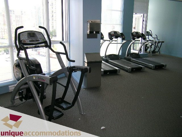 Bright fitness room with treadmills and city view. - 1904 - 1199 Seymour Street, Vancouver Downtown