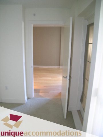 Spacious den with hardwood floors and a cozy carpeted area. - 104 - 175 W. 1st. Street, North Vancouver