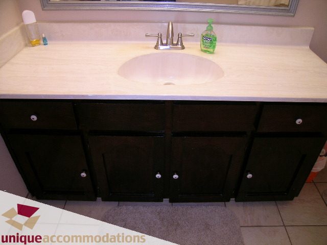 Bathroom with light countertop and dark cabinets. - 94 Bonnymuir Drive, West Vancouver