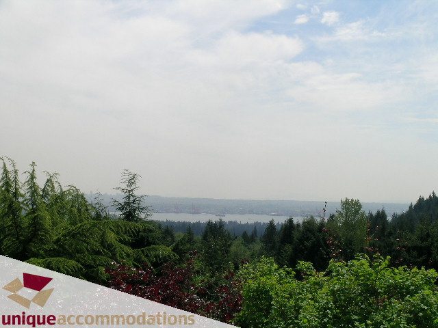 Panoramic view of lush greenery and distant mountains, perfect for relaxation. - 94 Bonnymuir Drive, West Vancouver