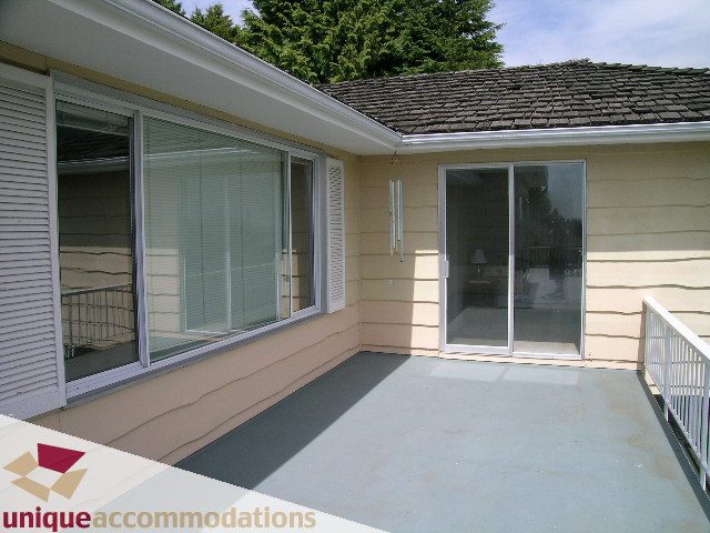 Furnished patio with sliding glass doors and modern design. - 94 Bonnymuir Drive, West Vancouver