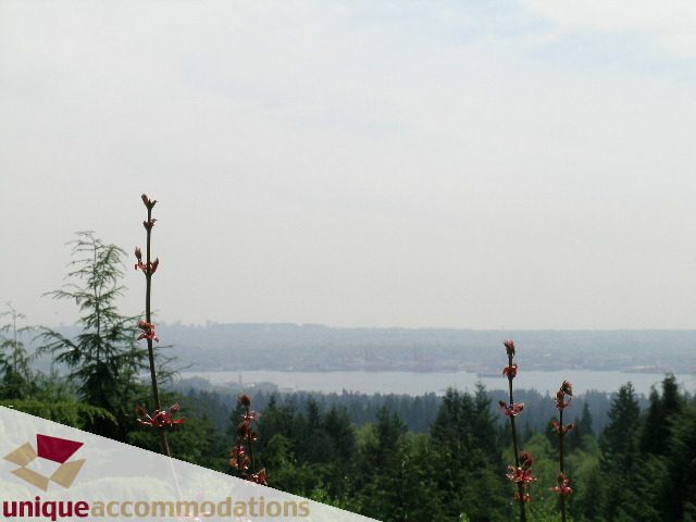 Bright living room with stunning city view and lush greenery. - 94 Bonnymuir Drive, West Vancouver