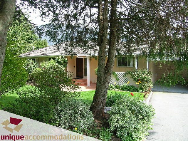 Furnished 3-bedroom house with a welcoming front porch and lush greenery. - 94 Bonnymuir Drive, West Vancouver