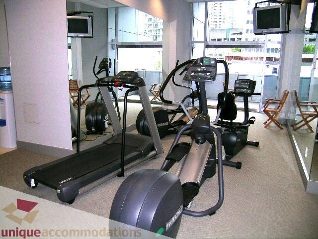 Bright, modern gym with treadmills, ellipticals, and city views. - 602 - 1233 West Cordova Street, Vancouver Downtown