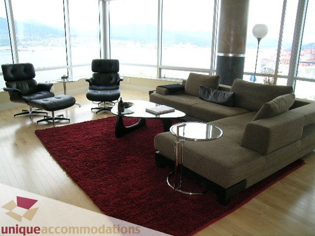 Spacious living room with large windows, hardwood floors, and a view of the city. - 2401 - 1077 W. Cordova Street, Vancouver Downtown