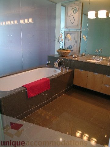 Spacious bathroom with modern fixtures, sleek countertops, and a large bathtub. - 2401 - 1077 W. Cordova Street, Vancouver Downtown