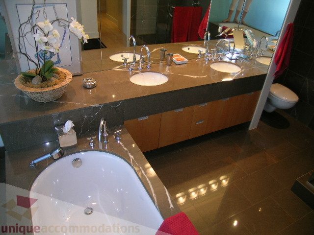 Modern bathroom with sleek countertops and a luxurious bathtub. - 2401 - 1077 W. Cordova Street, Vancouver Downtown