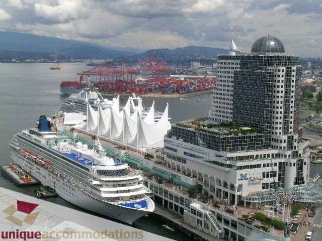 Spacious 2-bedroom condo with stunning city view, overlooking the bustling harbor and iconic cruise ship.