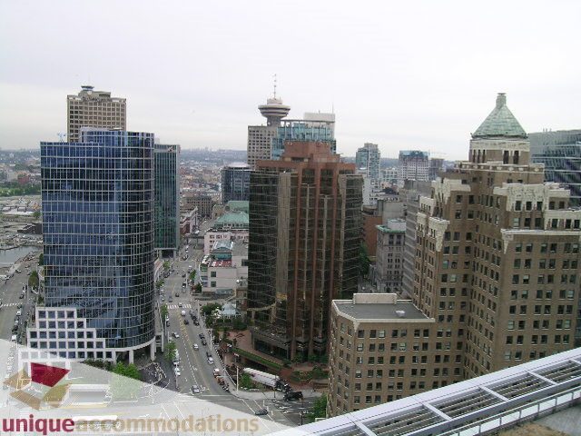 Spacious 2-bedroom condo with stunning city views, featuring modern furnishings and a balcony. - 2401 - 1077 W. Cordova Street, Vancouver Downtown