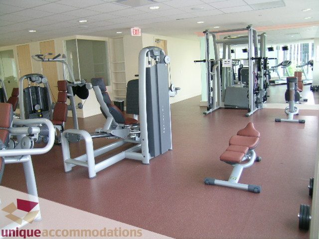 Spacious, well-equipped gym with various weight machines and cardio equipment. - 2401 - 1077 W. Cordova Street, Vancouver Downtown