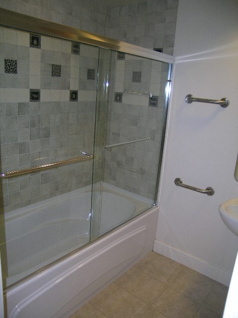 Spacious bathroom with glass shower and modern fixtures. - 947 Huntingdon Crescent, North Vancouver
