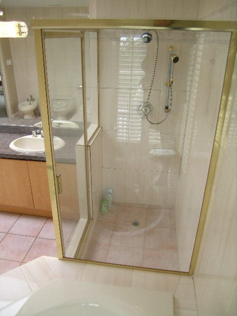 Bright bathroom with modern shower and marble countertops. - 1233 11th Street, West Vancouver