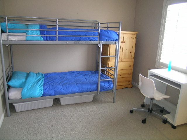 Bright bedroom with bunk beds, desk, and chair. - 1233 11th Street, West Vancouver