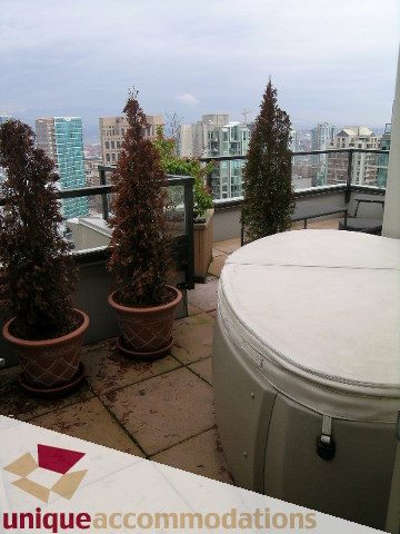 Furnished balcony with city view and potted plants. - PH2 - 969 Richards Street, Vancouver Downtown