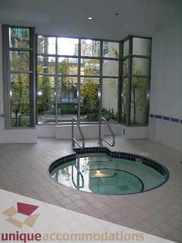 Spacious 1-bedroom + den condo with a serene indoor pool and large windows offering a city view. - 603 - 1328 West Pender, Vancouver Downtown