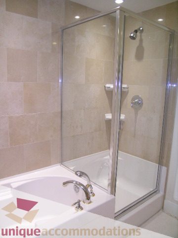 Modern bathroom with sleek shower and white countertop. - 3005 - 1483 Homer Street, Vancouver Downtown
