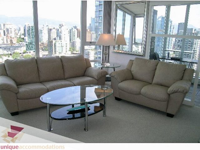 Furnished living room with city view and modern furniture. - 2706 - 1438 Richards Street, Vancouver Downtown