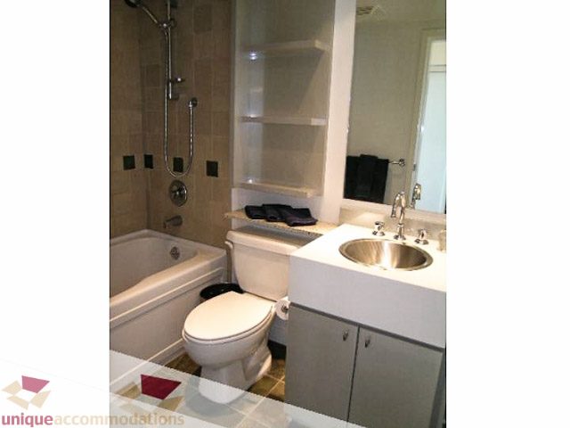 Furnished bathroom with modern sink, toilet, and shower. - 2706 - 1438 Richards Street, Vancouver Downtown