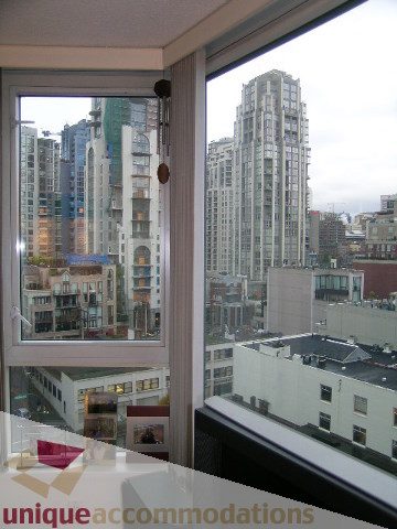 Spacious 2-bedroom + den condo with a stunning city view from the large window, featuring sleek countertops and modern...