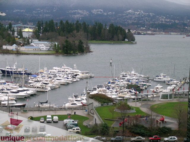 Bright living room with city view and marina scene. - 905 - 1331 West Georgia Street, Vancouver Downtown