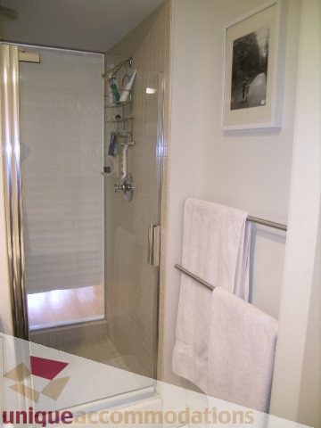 Furnished bathroom with a towel rack and a framed picture on the wall. - 503-1072 Hamilton St., Vancouver Downtown