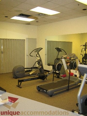 Bright and spacious gym with treadmills and mirrors, perfect for fitness enthusiasts. - 1906 - 1060 Alberni Street, Vancouver Downtown