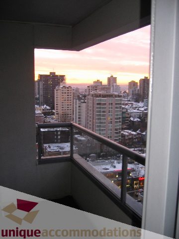 Furnished 1-bedroom balcony with city view at sunset. - 1906 - 1060 Alberni Street, Vancouver Downtown