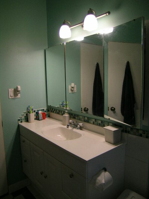 Bathroom with white countertop, dual sinks, and green walls. - 433 Fairway Drive, North Vancouver