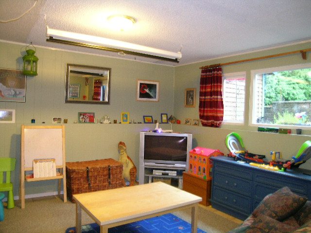 Bright playroom with colorful toys, wooden table, and green lantern. - 433 Fairway Drive, North Vancouver