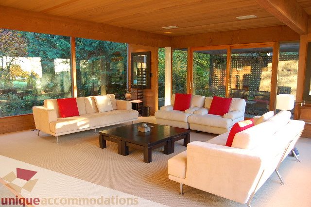 Bright living room with large windows, natural light, and modern furniture. - 6290 Collingwood Street, Vancouver West Side