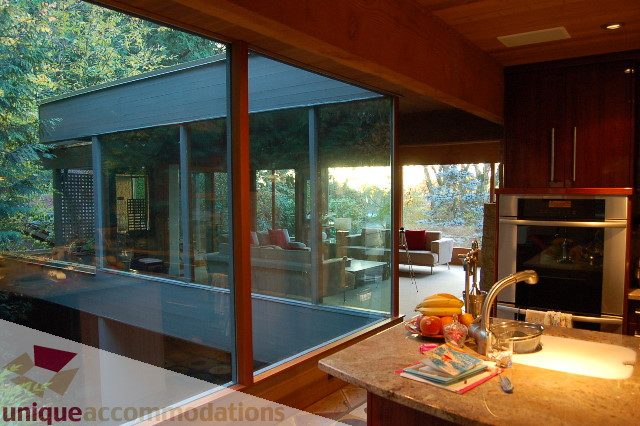 Bright kitchen with granite countertops, modern appliances, and a view of the garden. - 6290 Collingwood Street, Vancouver West Side