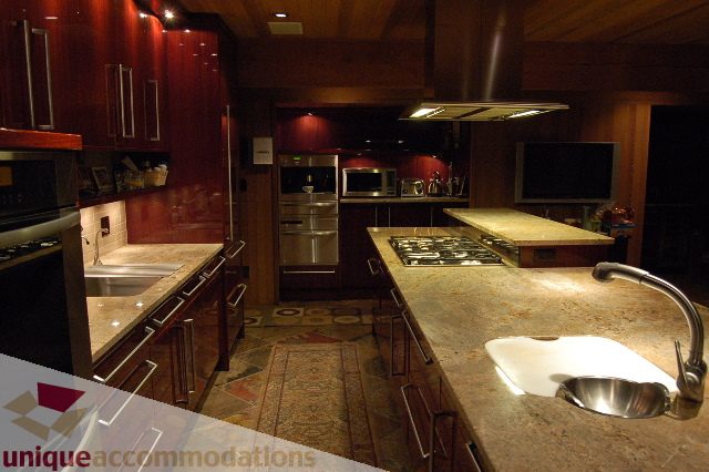 Bright kitchen with granite countertops and stainless steel appliances. - 6290 Collingwood Street, Vancouver West Side