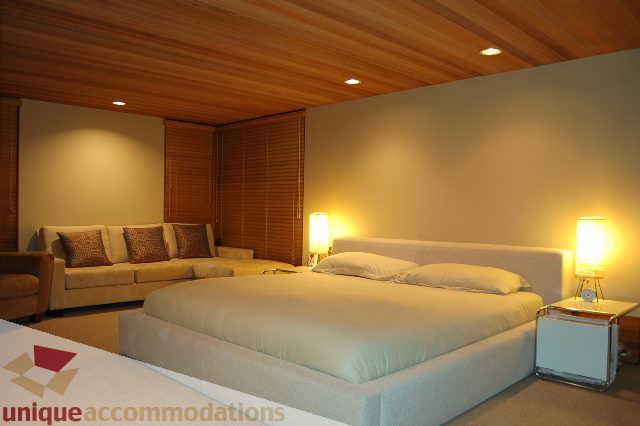 Spacious living room with modern furniture and wooden ceiling. - 6290 Collingwood Street, Vancouver West Side