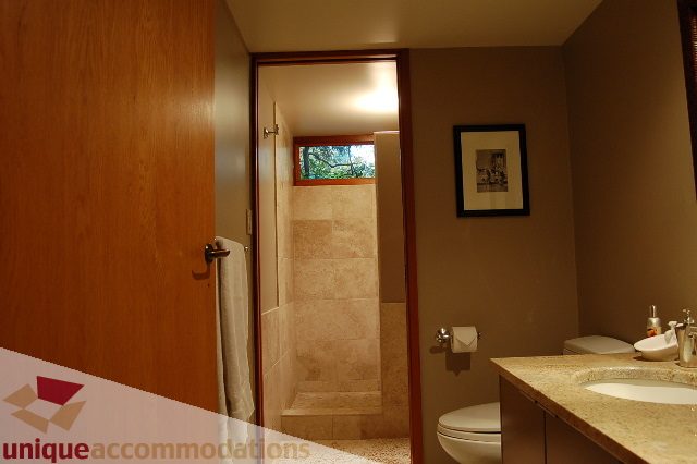 Bathroom with granite countertops and framed artwork. - 6290 Collingwood Street, Vancouver West Side