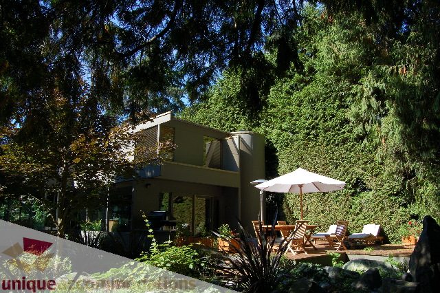 Furnished living room with large windows and outdoor patio access. - 6290 Collingwood Street, Vancouver West Side