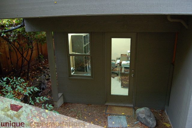 Furnished living room with large windows and garden view. - 6290 Collingwood Street, Vancouver West Side