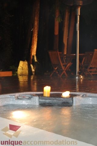Jacuzzi with candles and outdoor seating area. - 6290 Collingwood Street, Vancouver West Side