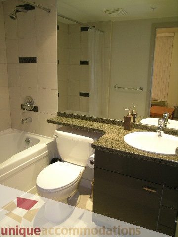 Spacious bathroom with granite countertops and modern fixtures. - 1430 Strathmore Mews, Vancouver Downtown
