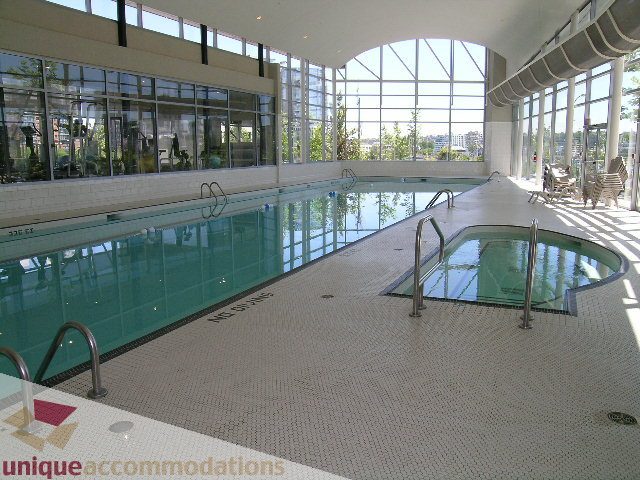 Spacious indoor pool with city view and modern design. - 1430 Strathmore Mews, Vancouver Downtown