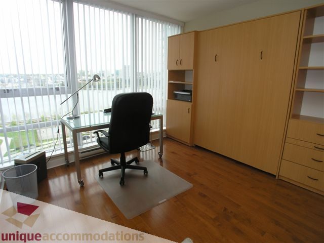 Spacious office with hardwood floors, city view, and built-in cabinets. - 1008 - 1408 Strathmore Mews, Vancouver Downtown
