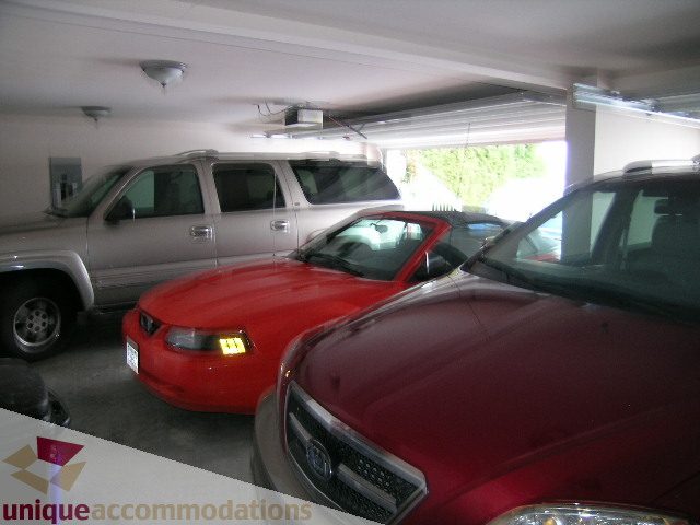 Garage with parked cars, clean and organized. - 1659 Langton Place, West Vancouver