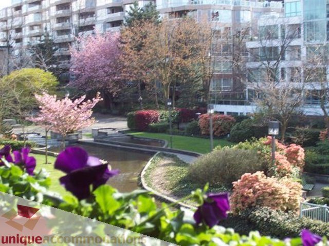 Furnished 1-bedroom with city view and vibrant garden. - 313-525 Wheelhouse Square, Vancouver West Side