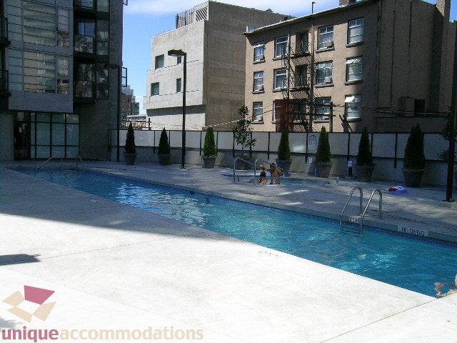 Furnished rooftop patio with a swimming pool and city views. - 1135 Seymour Street, Vancouver Downtown