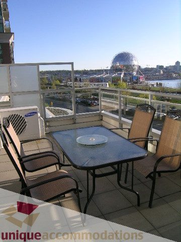 Furnished patio with outdoor seating and a city view. - 305 - 1030 Quebec Street, Vancouver Downtown