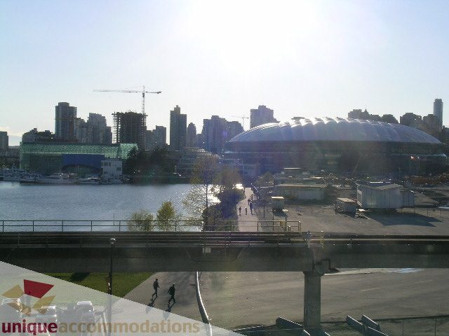 Bright living room with city view and waterfront access. - 305 - 1030 Quebec Street, Vancouver Downtown